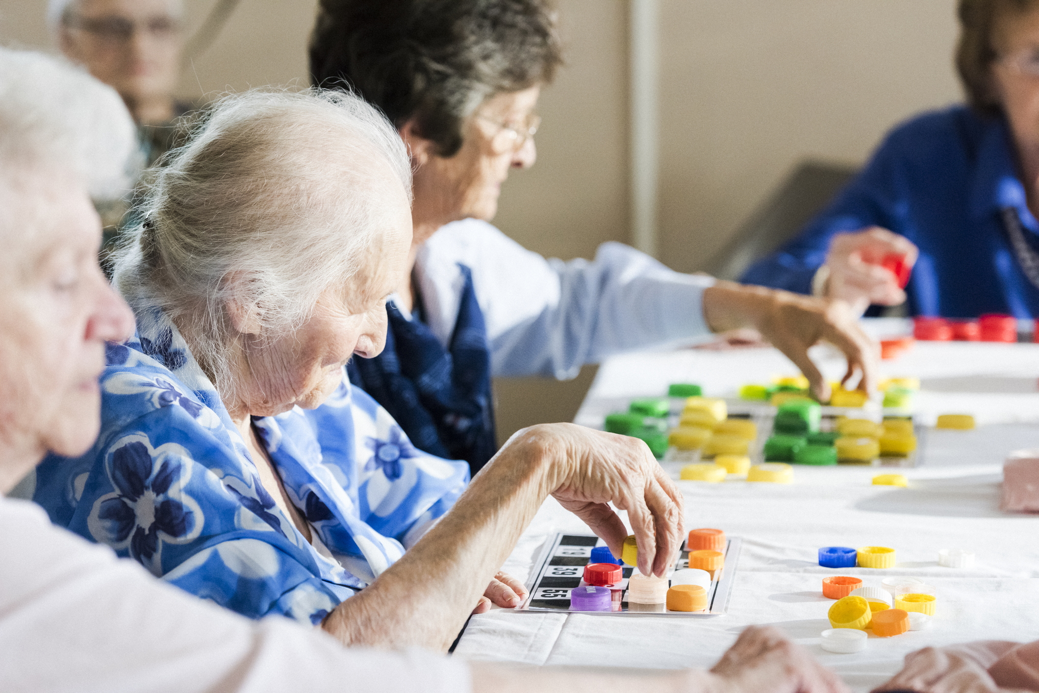 Senior women playing multiple bingo cards
