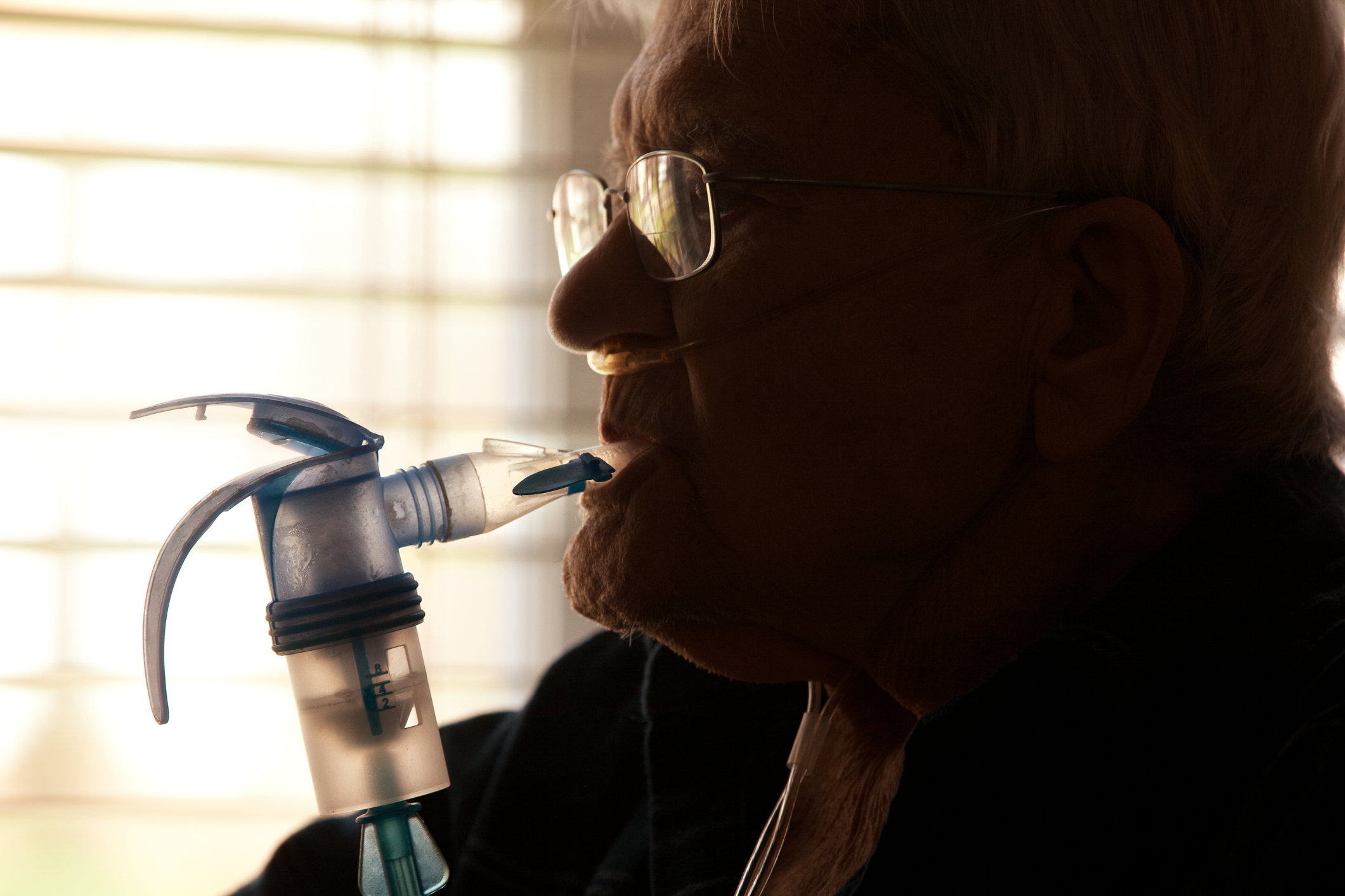 Elderly Man Using Nebulizer